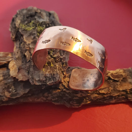 Copper trout and fly stamped cuff bracelet